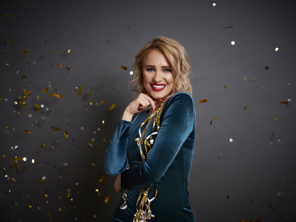 beautiful woman with streamer shower confetti