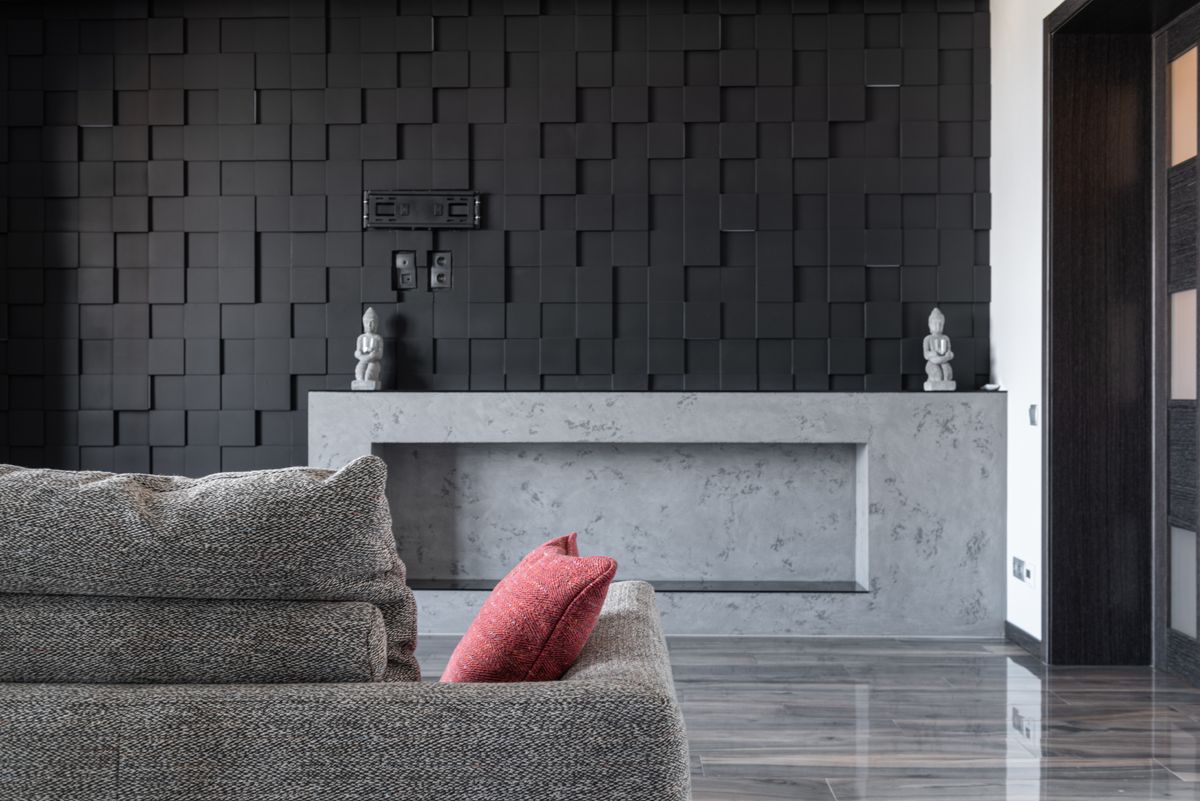 Phòng khách với mặt sàn xám bóng nhẹ và sofa xám
